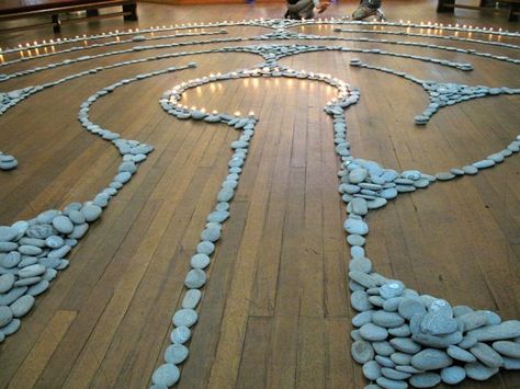 Wooden floor, piled river stone layout and a fire surround. One of the most beautiful labyrinths I have ever seen.  "For about 4 days before Easter, St Matthew-in-the-city sets out a labyrinth in river stones and candles. The church fills with music: sometimes a choir, maybe electronic music, maybe the sound of a river gurgling by." Labyrinth Ideas, Moving Meditation, Ritual Ideas, Christian Spirituality, Spiritual Places, Log Ideas, Labyrinth Art, Prayer Room Ideas, Prayer Stations