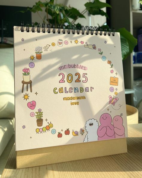 After months of drawing and sampling, our 2025 calendar is finally available for sale!!💖 I really hope you will like it🫶🏻 Each set comes with: -2025 Calendar -Acrylic stand with clip -Sticker sheet Link in Bio! #calendar #2025calendar #mrbubbles #nimbus #petals #jessdessin #illustration #cuteillustrations #characterdesign #art #digitalart Calender Diy, Month Illustration, Calendar Acrylic, Calendar Doodles, Creative Book Cover Designs, Illustration Calendar, Creative Book Covers, Burning Desire, Canvas Learning