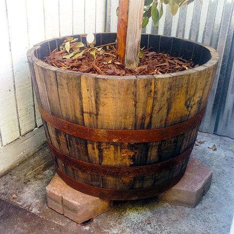 Whiskey barrels make great planters but they require a bit of prep work before they are ready to use. | Charles & Hudson | #gardening #diyplanter Diy Whiskey Barrel, Diy Whiskey, Whiskey Barrel Planter, Barrel Flowers, Wine Barrel Planter, Whiskey Barrels, Strawberry Planters, Diy Trellis, Barrel Planter