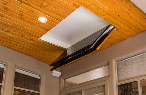 Folding Ceiling TV Mount | Cool Patio Flip Down TV Outside - Nexus 21 Tv Mount Outside Patio, Tv Outside Patio Outdoor Tv Cabinet, Retractable Tv Ceiling, Under Deck Tv Ideas, Hidden Ceiling Tv, Flip Down Ceiling Tv Mount, Fold Down Outdoor Tv, Pull Down Tv Mount Ceiling, Fold Up Tv Mount