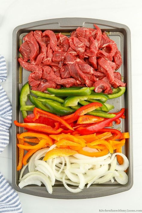 Fajitas are one of my favorite meals and are sure to become yours with this recipe. This Sheet Pan Steak Fajitas recipe is so good and will feed your whole family. With a few simple ingredients, you will have a delicious meal ready to serve in no time. Sheet Pan Flank Steak Fajitas, One Sheet Pan Fajitas, How To Cook Fajita Meat, Sheetpan Fajitas Beef, Steak Fajita Casserole Recipe, Sheet Pan Beef Fajitas, Fajitas Steak, Baked Fajitas, Sheet Pan Steak Fajitas