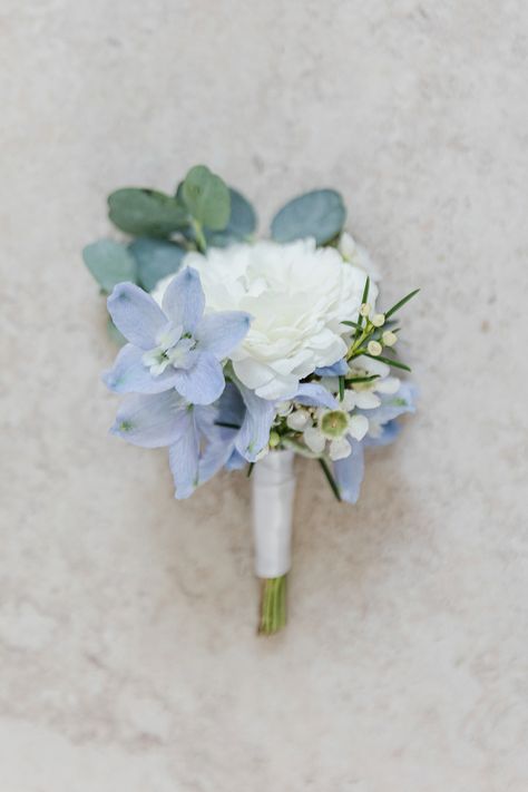 Green And Blue Boutonniere, Powder Blue Boutonniere, White Ranunculus Blue Delphinium Boutonniere, Blue Wildflower Boutonniere, Mountain Wedding Flowers Summer, Light Blue And White Corsage And Boutonniere, White And Blue Flower Boutonniere, Dusty Blue And Sage Green Boutonniere, Light Blue And White Boutonniere