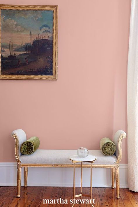 This perfect pink paint color is an updated take on the Millennial pink shade that you can use in any room of your home. This muted pink shade looks like the inside of a seashell and is considered a neutral pink paint color that will add some warmth and charm to your space. #paintcolors #marthastewart #paintideas #paintcolorideas #bestpaintcolors #homeinspiration Muted Pink Bedroom, Neutral Pink Bedroom, Pastel Color Wall, Pastel Wall Color, Mcm Bedroom, Indoor Paint Colors, Pink Painted Walls, Timeless Paint Colors, Bedroom Colours