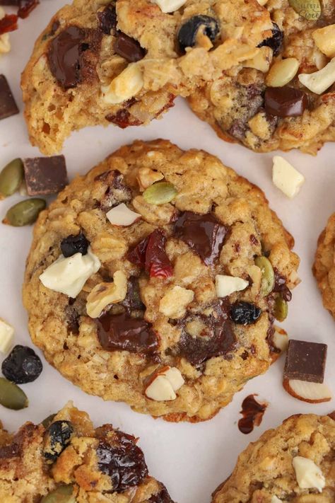 These soft and chewy Trail Mix Cookies are loaded with oats, nuts, seeds, dried fruit, and chocolate chips. Trail Mix Cookies Healthy, Cookies With Dried Fruit, Dried Fruit And Nut Mix Recipes, Trail Mix Cookies Recipe, Dried Fruit Cookies Recipe, Fruit And Nut Cookies, Granola Cookies Recipe, Dried Fruit Cookies, Snack Diet