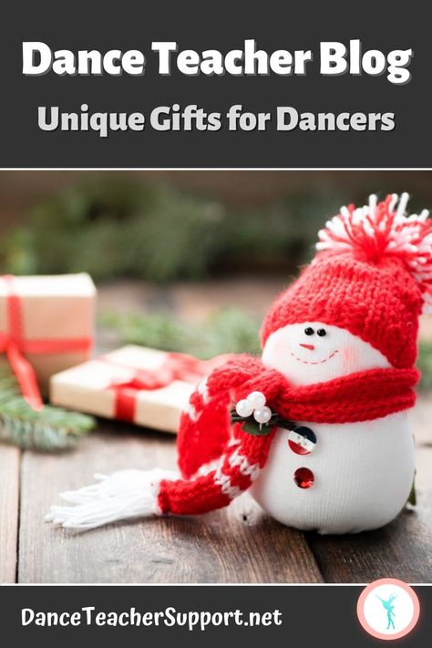 A smiling knit snowman wearing a red hat and scarf sitting on a brown table. Also on the table are two brown wrapped packages with red ribbons and evergreen branches. Dance Teacher Gifts Christmas, Christmas Gift For Dance Teacher, Thank You Gifts For Dance Teachers, Handmade Dance Teacher Gifts, Christmas Gifts For Dancers, Dancer Gift, Dance Teachers, The Dancer, Gift Suggestions