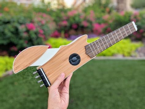 The Ava ukulele has a fold-out wing to help with forearm playing comfort Travel Ukulele, Ukulele Diy, Handmade Instruments, Dulcimer Music, Old Musical Instruments, Ukulele Design, Wooden Musical Instruments, Cool Ukulele, Homemade Instruments