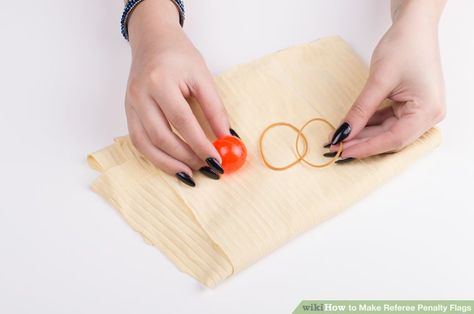 3 Ways to Make Referee Penalty Flags - wikiHow Diy Referee Shirt, How To Make Football Penalty Flags, Penalty Flags Napkins, Hockey Referee, Fishing Sinkers, Football Referee, Football Diy, College Games, One Balloon