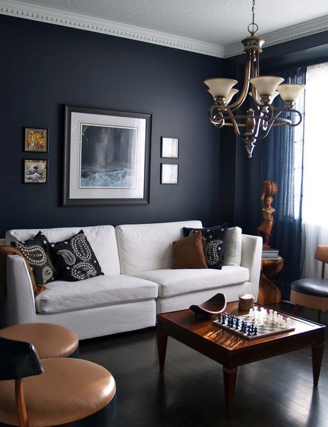 living rooms with dark navy blue walls with white sofa and classic chandelier Navy Living Rooms, Navy Blue Living Room, Furnitur Ruang Keluarga, Dark Living Rooms, Living Room Images, Black Living Room, Yellow Living Room, Living Room Color Schemes, Design Apartment