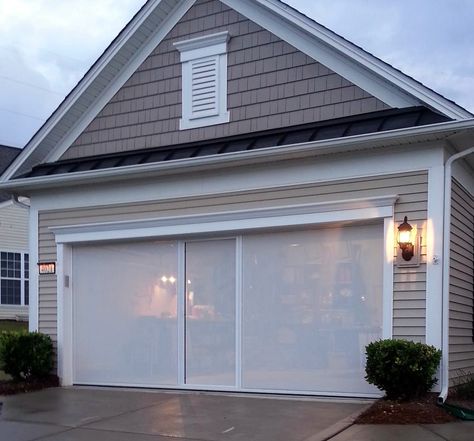 These screens are custom-made for your garage opening, and allow you to transform that space into a bug-free, private, and enjoyable space. Rolling Garage Door, Garage Door Screen, Garage Screen, Garage Door Track, Roll Up Garage Door, Aluminum Screen Doors, Garage Extension, White Garage, Garage Screen Door