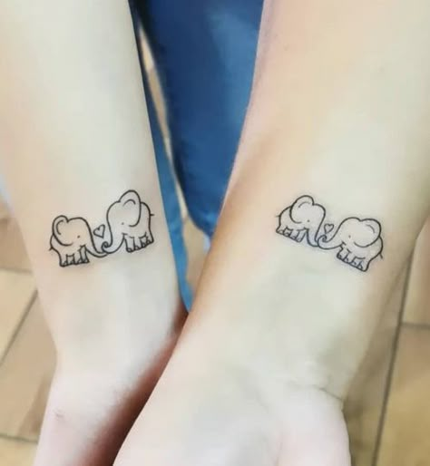 Simple Elephant Tattoos in Popular Styles for Inspiration | Inku Paw Elephant Tattoos Couple, Mother And Daughter Elephant Tattoo, Twin Elephant Tattoo, Sister Elephant Tattoos, Mother Daughter Frog Tattoos, Mom Daughter Tattoos Elephant, Couple Elephant Tattoo, Matching Elephant Tattoos Mom, Elephant Sister Tattoo