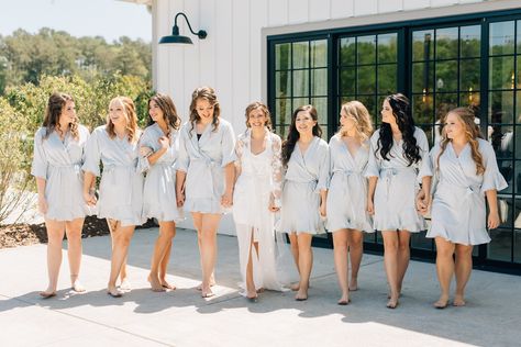 "As your wedding day approaches, you crave picture-perfect moments at every turn. Our ruffle bridesmaids robe are comfortable, fashion-forward robes that crafted with high-quality satin, offering a range of sizes and a spectrum color options. Personalize with a monogram for that final touch. Gift your bridesmaids our flounce ruffle robes, made of chiffon satin with a luxe matte finish. Featuring internal and external ties, these knee-length robes are a perfect surprise for the bridal party. Complete your wedding day with our kimono-style robes, easy to mix-and-match to create your unique bridal party look. Whether it's the maid of honor, mother of the bride, or bridesmaids, our white robe with delicate ruffles in sage green, emerald green, blush pink, or dusty rose will make them feel spec Bridal Party Robe Pictures, Bridesmaids Robes Pictures, Gifts For Bridal Party, Robes Bridesmaids, Bridesmaid Gifts From Bride, White Bridal Robe, Touch Gift, Wedding Party Robes, Monogram Robes