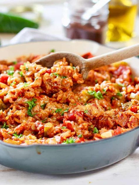 This our Best Spanish Rice recipe! We make it again and again. It's a one pot wonder of a side dish. Simple ingredients combined to make a ton of flavor! #spanishrice #easyrice #ricedish Spanish Rice Recipe With Ground Beef And Bacon, Spanish Rice Recipe With Bacon, Spanish Rice With Bacon, Spanish Rice Recipe With Ground Beef, Best Spanish Rice, Best Spanish Rice Recipe, Mexican Rice Dishes, Spanish Dinner, Rice Dishes Recipes