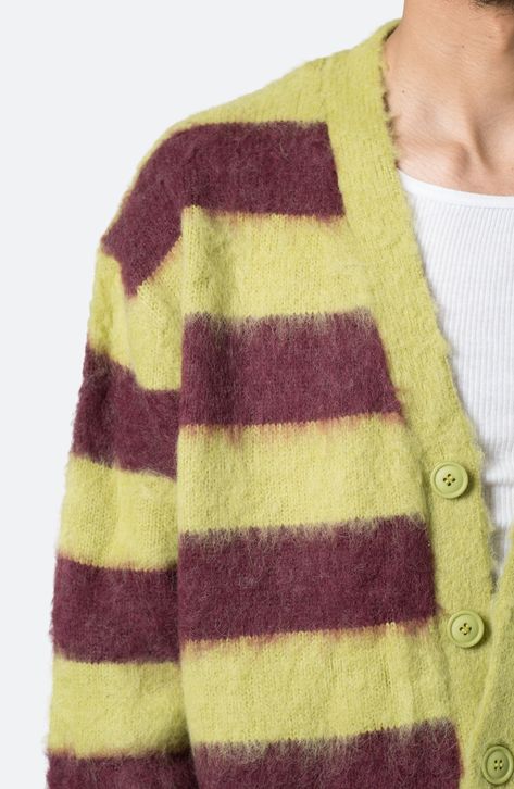 Brushed faux-mohair yarns create a delightfully fuzzy texture on this striped cardigan cut in a standard fit with ribbed detail. 26" length Front button closure V-neck Ribbed cuffs and hem 100% polyester Machine wash, dry flat Imported Fuzzy Cardigan Outfit, Unif Cardigan, Archive Pieces, Grandma Cardigan, College Wardrobe, Fuzzy Texture, Brown Knit Sweater, Argyle Cardigan, Cold Fits