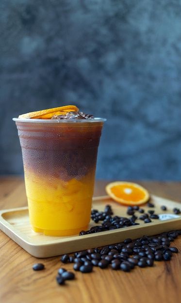 Coffee Orange Juice, Orange Coffee Drink, Ice Americano Coffee, Iced Coffee Photography, Yellow Coffee Shop, Acai Bar, Iced Black Coffee, Cafe Poster, Fruit Coffee