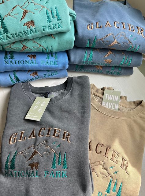 We sell primarily on our website where we offer free shipping and more colour options. TwinRavenCo Outfit yourself for a wild ride with our Glacier National Park Crew, boasting a simple yet stunning mountain landscape. Conquer the terrain in comfort and style - this quality piece is an outdoorsy essential! Available in so many colours, you'll feel fab from first light 'til night. 𓄿 Pigment Dyed giving that perfect vintage look- -please allow for very slight colour variation.  𓄿 Unisex- standard fit 𓄿 Split stitch double needle sewing on all seams 𓄿 Twill neck tape 𓄿 1 x 1 ribbing at neck, cuffs and waistband 𓄿 The highest quality, sustainable threads are used. This embroidery is made to last! * Check out our socials for discounts, new releases, and to see how we run our shop: TwinRav Cute Crew Neck Sweatshirts, Gifts For Outdoorsy Women, Vintage Sweatshirt Outfit, Granola Outfits Winter, Granola Outfits, National Park Sweatshirt, Vintage Crew Neck, Split Stitch, Outdoorsy Style