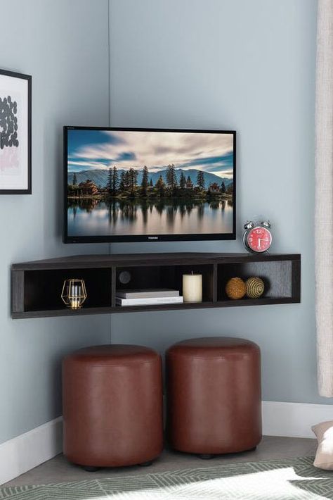 20 Floating Shelves Ideas, So You Can Create Extra Storage Space That Isn’t an Eyesore #purewow #organizing #home #decor #home picks Floating Corner Tv Stand, Corner Tv Ideas, Corner Tv Console, Deco Tv, Wall Mounted Media Console, Corner Tv Stands, Corner Tv Unit, Small Condo, Floating Tv Stand