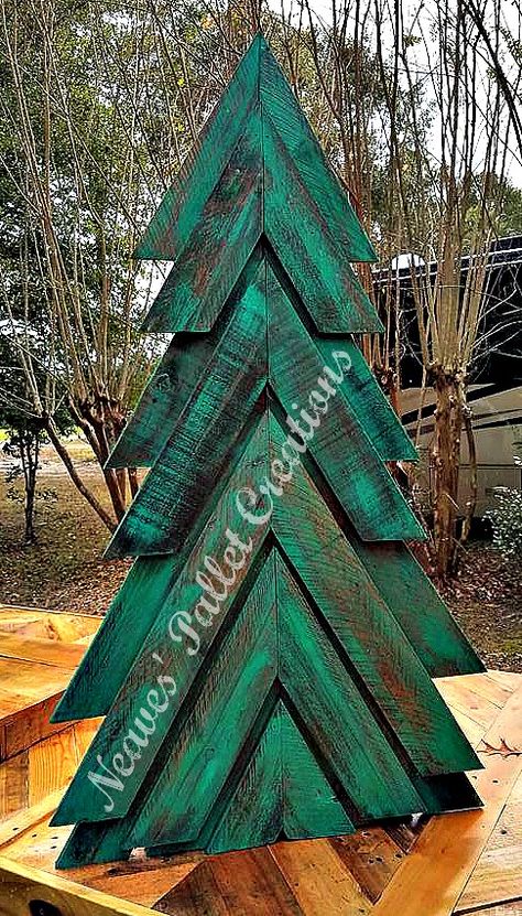 RECYCLED WOOD PALLET: Here is our painted and stained Double-Angled Christmas Tree we posted earlier. We can make more in red, just stain or white. This one is free standing but we can make it with a yard stake. Right now this is the only size we make, it is 45" tall x 25" wide and we are asking $50. That's painted and or stained. (This has the wood of a double pallet wood tree.) Message us if you would like to place an order. Item # 1,282 How To Decorate A Wooden Pallet Christmas Tree, Wooden Pallet Trees Christmas, Pallets Christmas Trees, Pallet Xmas Tree Ideas, Holiday Pallet Ideas, Pallet Wood Christmas Trees, Handmade Wood Crafts Ideas, Pallet Wood Christmas Projects, Christmas Pallet Crafts