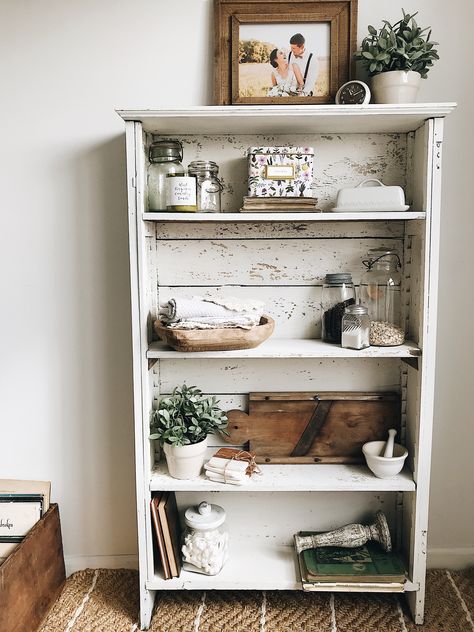 Milk paint bookshelf decor chippy white farmhouse rustic antique salvage kitchen shelf Rustic White Bookshelf, Bookshelf Nightstand Farmhouse, Rustic Farmhouse Bookshelf, Antique Bookshelf In Kitchen, Small Vintage Bookshelf, Rustic Bookshelf Ideas, Kitchen Bookshelf Ideas, Paint Bookshelf, Farmhouse Bookshelf Decor