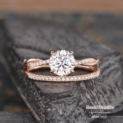 "Moissanite Engagement Ring Rose Gold Twist Infinity Solitaire Moissanite Diamond Half Eternity Ring Bridal Women Promise Ring Anniversary Same design with 6 prongs: https://www.etsy.com/listing/643797587 Interested in bridal set: https://www.etsy.com/listing/651183149 Same design with different gemstone: https://www.etsy.com/listing/609590330 https://www.etsy.com/listing/655314606 https://www.etsy.com/listing/654797976 ITEM INFORMATION Metal Type - Solid 14k Rose Gold Band Width - (approx. 2.3mm) Center Stone - 7mm Moissanite, Round Cut Clarity - VVS Color -  D-E-F Side Stone - Natural Diamond, H color , SI clarity Or Moissanite, D-E-F color, VVS clarity Weight - 0.3ct total **Stone Replacement** Available with any other gemstones, please feel free to contact me for a quote. **Metal Type* Engagement Rings With Rose Gold, White And Rose Gold Engagement Rings, Wedding Ring With Infinity Band, Moissanite Twist Engagement Ring, Engagement Rings Braided Band, Rose Gold And Silver Wedding Ring Sets, Silver And Rose Gold Engagement Ring, Rose Gold Rings Engagement Simple, Rose Gold And Silver Engagement Ring