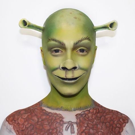 Niall ♡ on Instagram: “ogres are like onions... 💚 say hello to Miss Shrek💅 @charlotteroberts inspo 💖 @mehronmakeup bald cap and spirit gum @heatherloucosmetics…” Face Painting Costume, Shrek Makeup Cute, Shrek Face Paint, Shrek Makeup Ideas, Shrek Fiona Makeup, Bald Halloween Costumes, Bald Cap Makeup, Shrek Makeup Collection, Bald Characters