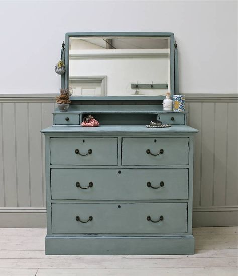 Vintage distressed mirror dressing chest.A beautifully proportioned set of vintage drawers with dressing table top and swivel mirror with original aged glass. Finished in Duck Egg Blue chalk paint. Moderately distressed and waxed. Each individual piece of furniture upcycled by Distressed but not Forsaken is an original antique or vintage item and is therefore totally unique and a one-off.Solid wood. Height: 150cm Width: 99cm Depth: 53cm Blue Wallpaper Bedroom, Black Upholstered Bed, Shabby Chic Dressing Table, Chest Of Drawers With Mirror, Shabby Chic Chest Of Drawers, Dressing Table And Chest Of Drawers, Apps Social Media, Dressing Table With Drawers, Mirror Dressing