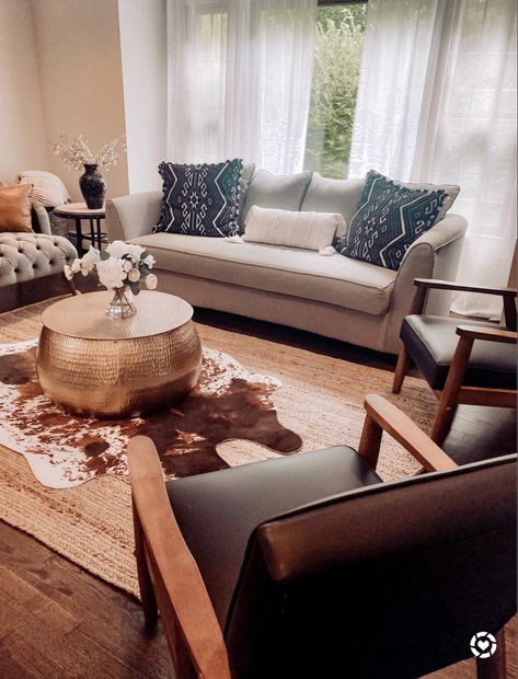 Cowskin Rug Living Room, Cow Hide Rug Living Room Boho, Cowhide Rug White Couch, Faux Animal Skin Rug Living Room, Cow Print Rug Living Room, Layering Cowhide Rug Living Room, Cow Hide Rug Over Jute Rug, Layered Cowhide Rug Living Room, Cowhide Rug Living Room Farmhouse