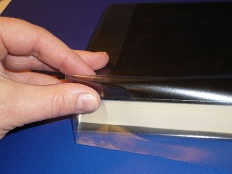 How to Make a Durable Plastic Book Cover: 12 Steps (with Pictures) Book Care, Book Binding Diy, Book Protector, Sheet Protector, Sheet Protectors, Saran Wrap, Slip Covers, 12 Steps, Diy Book