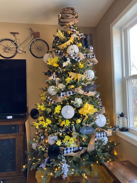 Decorated with Dollar Tree items and paperbag beehive on top. Bee Happy Honeybee Christmas Tree, Seasonal Tree Ideas, Honey Bee Christmas Tree, Bumble Bee Christmas Tree, Bee Themed Christmas Tree, Bee Tree Decorations, Christmas Tree Yellow Decor, Year Round Tree Ideas, Summer Tree Decorating Ideas