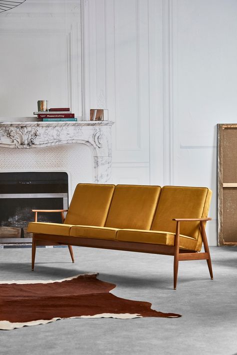 Relax on the exquisitely comfortable Fox Sofa. It is a contemporary addition to the original Lounge Chair, designed in the 1960s which is often considered the second-most popular piece of Polish Mid-Century furniture. This contemporary reissue by 366 Concept is made of top quality, hand-selected solid ash and finished with brass details, giving the product a luxe edge. Each sofa is custom made with solid ash and finished with stunning brass. The sofa can be upholstered in an array of beautiful fabrics and colours - take a look through our gallery to see all the options available. Measures 78h x 170w x 70d cm with a seat height of 40cm ** When placing your order please write your colour selection in the box marked, 'Special Instructions for the Seller'. *** Please note: - Lead time is 8 - 9 Modern Settee, Cord Wood, Metal Armchair, Mid Century Modern Sofa, Kids Interior Room, Mid Century Sofa, Three Seater Sofa, Custom Sofa, Upholstery Fabrics