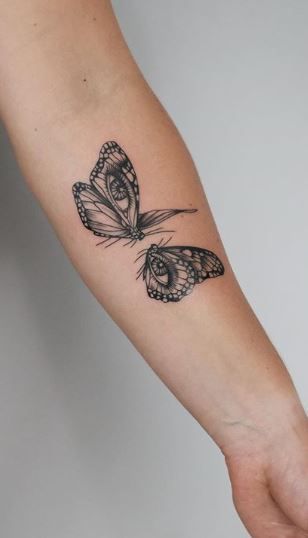 77 Beautiful Butterfly Tattoos - Plus Their Meaning & Photos Nice Tatoos, Eyes Butterfly Tattoo, Best Butterfly Tattoos, Butterfly Tattoo Forearm Men, Butterfly With Eyes On Wings Tattoo, Butterfly Time Tattoo, Evil Eye Butterfly Tattoo, Eye And Butterfly Tattoo, Butterfly In Elbow Tattoo