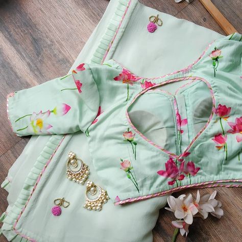 Pastel Green Saree with Hand Embroidered floral motifs, paired with lotus print satin Blouse! Saree & Blouse Courtesy @labelkanupriya… Blouse Back Neck Designs, Blouse Design Images, Sari Blouse Designs, Indian Saree Blouses Designs, Saree Blouse Patterns, Blouse Designs Silk, Unique Blouse Designs, Designer Saree Blouse Patterns, Saree Blouse Designs Latest