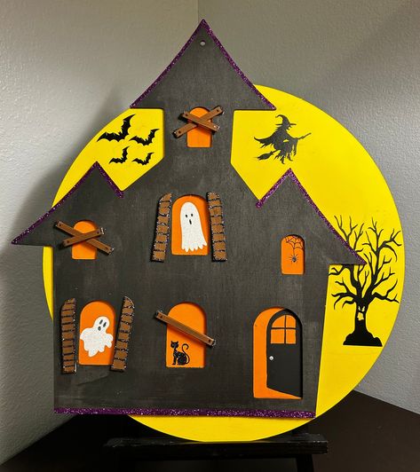 Hand painted & crafted Halloween door hanger. This haunted house will make a great spooky decoration displayed on a mantle or hanging on the front door. Halloween Door Crafts, Haunted House Kids Craft, Dollar Tree Haunted House Wood Cutout, Haunted House Crafts For Kids, Wood Haunted House, Diy Halloween Door Decorations, Spooky Door, Haunted House Craft, Halloween Diy Door