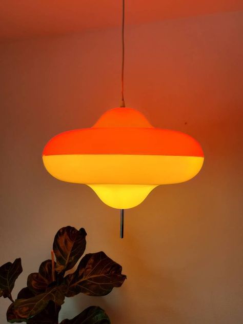 "This huge and extremly rare pendant lamp model Disco was designed by Cesare Maria Casati and Carlo Emanuele Ponzio in 1966 for Harvey Guzzini, Italy and produced by Meblo, Yugoslavia in early 70's. The lampshade of this amazing ceiling light is made of plastic in orange and white with a pole going through the middle and keeping the two parts together. This space age lamp is really an eye catcher. Very collectable for Meblo Guzzini lovers! 🧡 PLEASE READ THE CONDITION PART. CONDITION: This awsom Disco Light Fixture, Meblo Guzzini Lamp, Vintage Ceiling Lamp, 70s Lighting Fixtures, Champagne Poetry, Space Age Decor, Disco Lamp, Space Age Interior, Dopamine Design