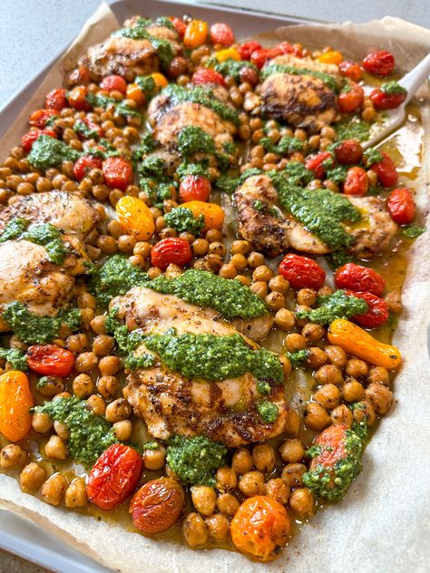 SHEET PAN CHICKEN THIGHS WITH CHERRY TOMATOES, CHICKPEAS, AND PESTO Low Carb Sheet Pan Recipes, Chicken Thigh Lunch Ideas, Baked Healthy Recipes, Jenn Eats Good, Weeknight Dinner Ideas Healthy, September Manifestation, Chicken Thigh Sheet Pan, Healthy Sheet Pan Dinners, Sheet Pan Chicken Thighs