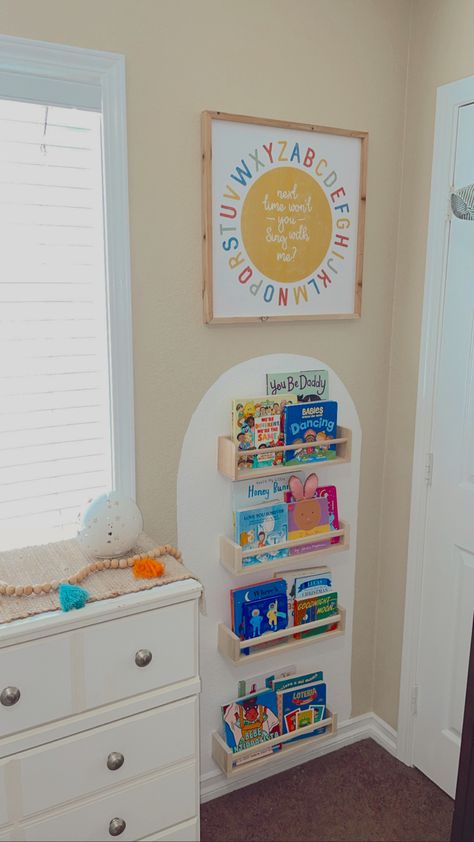 Book Corner Nursery Ideas, Arch Wall Paint Bookshelf, Playroom Wall Book Shelves, Toddler Wall Book Shelves, Ikea Shelves Kids, Cozy Earth Nursery, Nursery Ikea Bookshelf, Dresser In Playroom, Ikea Spice Rack Nursery Book Shelves