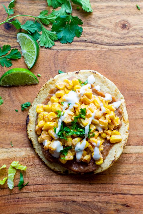 Creamy, sweet and spicy, these vegan tostadas with refried beans and Mexican street corn are delicious. Ready in 15 minutes, they're perfect for a quick weeknight meal or as part of a TexMex buffet spread for game night. ✨For the recipe, google "very veganish corn tostadas" or comment "BLOG" below and I'll DM you a clickable link to my website✨ Vegan Tostadas, Corn Tostadas, Corn And Beans, Sauteed Squash, Cholula Hot Sauce, Canning Refried Beans, Chili Lime Seasoning, Vegan Mexican Recipes, Leafy Green Salads