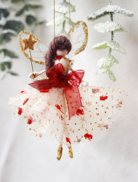 This little fairy is dressed in a glitter tulle gown with a red spotted tulle overlay. She has sashed her gown at the waist with a red Organza ribbon. She has little shoes dipped in glitter and of course, her glittered wand to grant you your wishes! Fairy Christmas Tree Ideas, Fairyland Christmas, Fairy Tree Topper, Fairy Christmas Ornaments, Tree Topper Fairy, Xmas Fairy, Christmas Tree Toppers Fairy, Fairy Christmas Tree, Tree Toppers Fairy Wire