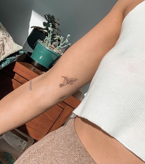 #tattoo, #tattoos, #inked, #tattooart, #tattooedwomen, #tattooedguys, #tattooinspiration, #tattooideas, #tattooworldwide, #tattoosociety, #InkLaughs, and #TattooFails​ Vertical Side Tattoos Women Ribs, One Line Hummingbird Tattoo, Small Tricep Tattoo Women, Bird Tattoo On Arm, Minimalist Hummingbird Tattoo, Costa Rica Tattoo Ideas, Simple Hummingbird Tattoo, Tattoos Minimal, Small Hummingbird Tattoo