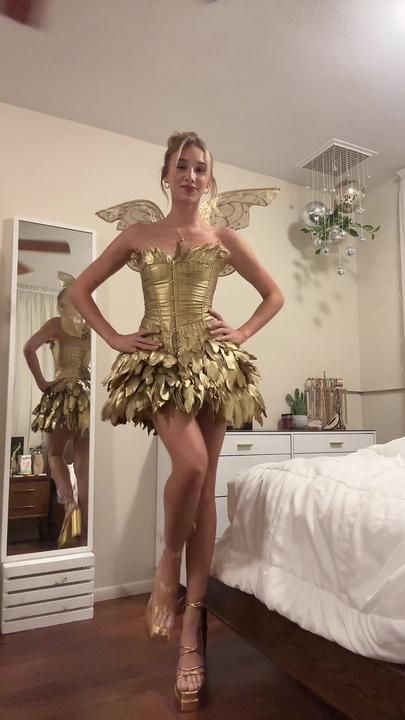 TikTok · Tessa Angel Halloween Costumes, Beautiful Feathers, Fairy Halloween Costumes, Book Day Costumes, Halloween Fairy, Golden Dress, Trendy Halloween Costumes, Iconic Dresses, Trendy Halloween