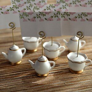 Le Prise™ Tea Time Whimsy Place Card Holder | Wayfair Tea Party Table Decorations, Bridal Shower Place Cards, Floral Place Cards, Diy Place Cards, Decorative Paper Napkins, Teacup Crafts, Tea Party Table, Yellow Resin, Bridal Tea Party