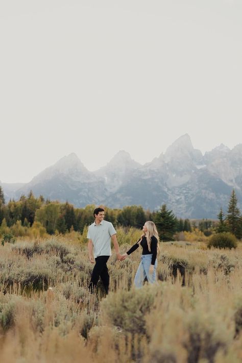 alice shoots people, grand teton wedding photographer, wyoming wedding photographer, jackson hole wedding photographer, engagement photos, engagement photo inspo, idaho engagement photos, teton photoshoot, engagement pose inspo, matching gold wedding rings, what to wear for engagement photos, casual engagement outfits, couple photoshoot, couple poses, unique engagement poses, candid poses, engagement photo outfit inspo, elope in the tetons, adventure engagement session, biracial couple photos Unique Engagement Poses, Photoshoot Couple Poses, Casual Engagement Outfit, Engagement Photos Casual, National Park Engagement Photos, Candid Poses, Poses Unique, Wyoming Wedding, Biracial Couples