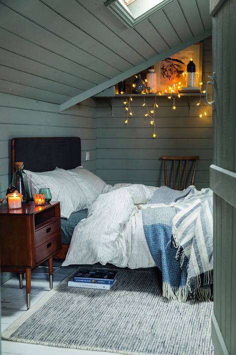 If you mainly use your #bedroom for evening lounging, #atmospheric, #low #level and #dimmable #lighting is a great option. We love the addition of these #delicate #fairy #lights to a #cosy #bedroom. For more #bedroom #lighting inspiration, take a look at our feature. Scandi Style Bedroom, Small Attic Room, Winter Bedroom Decor, Holiday Bedroom Decor, Scandi Bedroom, Bedroom Decor On A Budget, Scandinavian Design Bedroom, Holiday Bedroom, Winter Bedroom