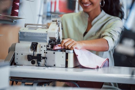 Dressmaker woman sews clothes on sewing machine in factory by mstandret. Dressmaker woman sews clothes on sewing machine in factory. #Sponsored #sews, #clothes, #Dressmaker, #woman Dressmaking, Sewing Machine, Fashion Store, Sewing, Quick Saves, Clothes