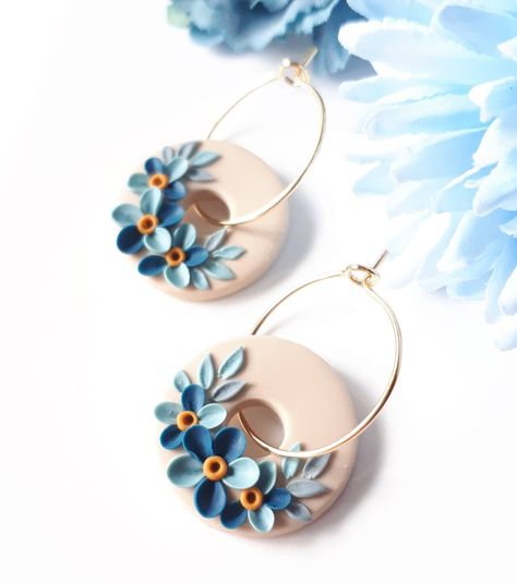 Tiny circle, Elegant blue flower earrings with gold hoops These are unique, handmade, polymer clay, floral earrings. Perfect earrings for your summer outfit. Length: 1.29 in. Drop Length: 0.78 in. The diameter of the hoop: 0.59 in  If you want a bigger hoop, please write to me Colors: Blue Florals Background: Beige with Gold hoop. The method is known as 'appliqued technique'. Using tiny pieces of clays and a sharp needle. I don't use molds to prepare my jewelry.  Each small parts of the motifs a Polymer Hoop Earrings, Polymer Clay Jewelry Techniques, Polymer Clay Art Jewelry, Blue Clay Earrings, Blue Flower Earrings, Polymer Clay Flower Jewelry, Diy Earrings Polymer Clay, Polymer Clay Jewelry Tutorials, Handmade Clay Jewelry