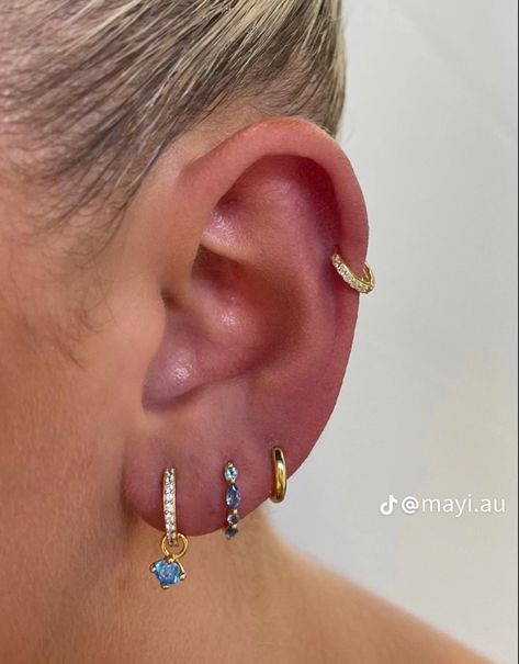 Gold blue jewelry earings ear piercing Earring Stack Ideas, Earring Stacks, Unique Ear Piercings, Ear Piercings Chart, Earring Inspo, Earring Stack, Pretty Ear Piercings, Cute Ear Piercings, Divine Energy