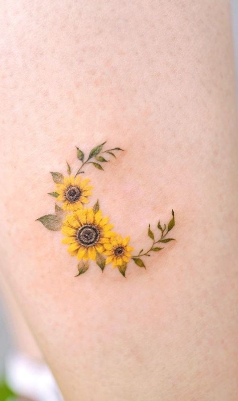 With their distinctive and brilliant appearance and with their rich symbolism, it’s easy to see why sunflower tattoos are a popular subject among tattoo artists and ink enthusiasts. From geometric designs to watercolor ink pieces, we've compiled a gallery with jaw-dropping sunflower tattoos you'll absolutely love. #sunflowertattoo #tattoo #tattoos Crescent Moon Sunflower Tattoo, Celestial Sunflower Tattoo, Sunflower Moon Tattoo Design, Three Sunflower Tattoo, 3 Sunflowers Tattoo, Moon And Sunflower Tattoo, Sunflowers Tattoo Ideas, 3 Sunflower Tattoo, Sunflower Moon Tattoo