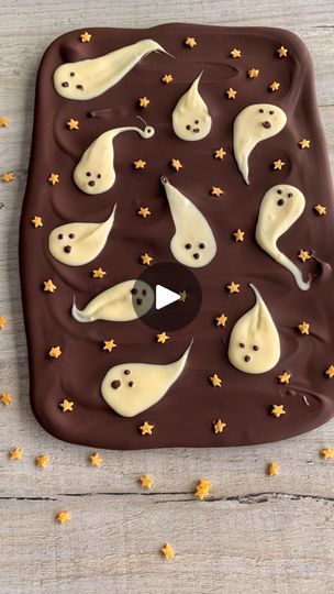 4.6M views · 297K reactions | Halloween ghost chocolate bark 😍

Here’s super fun and easy one to make for Halloween 🎃

Just melt dark or milk chocolate for the base, then dollop on blobs of melted white chocolate and drag a skewer through to create the ghosts 👻

All you need is:

300g dark or milk chocolate, melted
80g white chocolate, melted
Gold stars or Halloween sprinkles

Tin size: 9x13”

Enjoy!
#fitwaffle #fitwafflekitchen | Fitwaffle | Eloise Head Ghost Chocolate, Melted Gold, Melted White Chocolate, Halloween Sprinkles, Halloween Baking, Chocolate Bark, Holiday Candy, Different Holidays, Candy Desserts