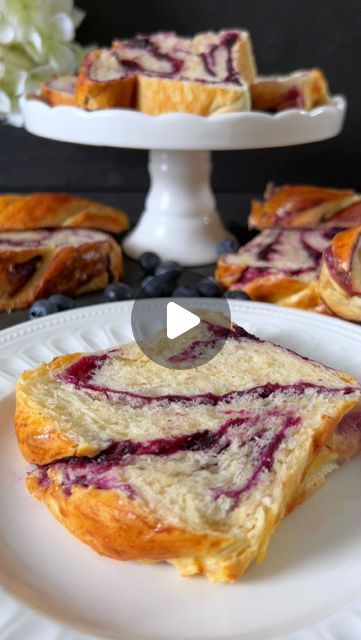 Food with Style 🤍 on Instagram: "Click here for the Recipe 🤍

Blueberry Brioche

The subtle sweetness of the dough perfectly complements the fruity filling, giving each bite a delicious kick 🥰🤍

📝 Ingredients:

For the Dough:
- 250 g flour
- 125 ml lukewarm milk
- 40 g sugar
- 1 egg
- 50 g soft butter
- 7 g dry yeast
- Pinch of salt

For the Blueberry Filling:
- 200 g fresh blueberries
- 45 g sugar
- Juice and zest of a small organic lemon

For the Surface:
- 1 egg yolk
- 1 tablespoon milk

🤍 Preparation:

1. In a pan, mix blueberries, sugar, lemon zest, and lemon juice. Heat on medium until the blueberries burst and the mixture slightly thickens. Set aside and let it cool.

2. In a bowl, place flour, create a well in the center, add dry yeast into the well, and pour one tablespoon o Blueberry Brioche, Blueberry Cakes, Blueberry Filling, Dessert Breads, Babka Recipe, Bread Art, Blueberry Bread, Breakfast Bread, Cookie Cake Recipe