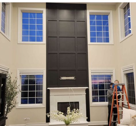 High Ceiling Fireplace Wall Modern, Tall Black Fireplace Wall High Ceilings, Tall Fireplace Accent Wall, Black Floor To Ceiling Fireplace, Urban Bronze Fireplace Wall, High Ceiling Living Room Tv Wall, Two Story Family Room With Fireplace, Two Story Accent Wall, 2 Story Fireplace Wall