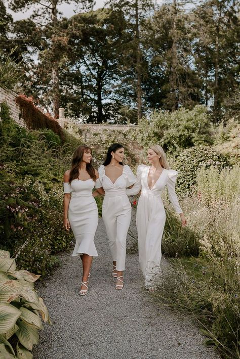 Bridal party wearing long and midi white bridesmaid dresses and neutral toned bouquets Champagne Gold Bridesmaid Dresses, Midi Bridesmaid Dresses, White Bridesmaid Dresses Long, White On White Wedding, Long Bridesmaid Dresses With Sleeves, Bridesmaids In White, Sparkly Bridesmaid Dress, Sparkly Bridesmaids, Sleeves Bridesmaid Dresses